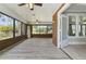 Spacious sunroom featuring brick walls and ample natural light at 306 Avenue C Ne, Winter Haven, FL 33881