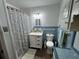 Charming bathroom featuring classic blue accents, creating a clean and inviting space at 308 Kerneywood St, Lakeland, FL 33803