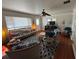 Cozy living room featuring comfortable seating, a ceiling fan, and natural light at 308 Kerneywood St, Lakeland, FL 33803