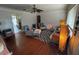 Spacious living room showcasing hardwood floors, stylish seating, and unique lighting accents at 308 Kerneywood St, Lakeland, FL 33803