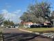 A quaint street view shows the property and surrounding area in a sunny atmosphere at 308 Kerneywood St, Lakeland, FL 33803