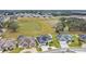 Aerial view of houses and a community at 3098 Pearly Dr, Lakeland, FL 33812