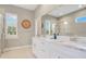 Elegant bathroom with double vanity and marble countertops at 3098 Pearly Dr, Lakeland, FL 33812