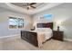 Spacious bedroom with dark wood furniture, neutral tones, and ample natural light at 3098 Pearly Dr, Lakeland, FL 33812