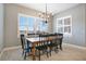 Farmhouse dining room with a large wooden table and six black chairs at 3098 Pearly Dr, Lakeland, FL 33812