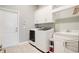 Convenient laundry room with washer, dryer, and storage at 3098 Pearly Dr, Lakeland, FL 33812