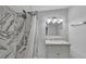 Bathroom with marble shower and vanity at 3220 Clubhouse Rd, Lakeland, FL 33812