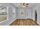 Dining area with hardwood floors, white door and ceiling fan at 3220 Clubhouse Rd, Lakeland, FL 33812