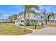 House with palm trees and a long driveway at 3220 Clubhouse Rd, Lakeland, FL 33812