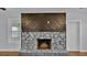 Stone fireplace with wood mantel at 3220 Clubhouse Rd, Lakeland, FL 33812