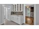 White cabinets, granite countertops, and a view into the dining area at 3220 Clubhouse Rd, Lakeland, FL 33812