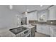 Modern kitchen with white cabinets, granite countertops and island at 3220 Clubhouse Rd, Lakeland, FL 33812