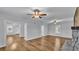 Open living area with hardwood floors and multiple ceiling fans at 3220 Clubhouse Rd, Lakeland, FL 33812