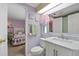 Bathroom with toilet and vanity; view of bedroom at 3221 Pebble Bend Dr, Lakeland, FL 33810