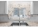 Kitchen sink with butterfly-themed window treatments at 3221 Pebble Bend Dr, Lakeland, FL 33810