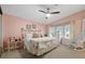 Main bedroom with king-size bed and bay window at 3221 Pebble Bend Dr, Lakeland, FL 33810