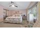 Spacious main bedroom with king-size bed and plenty of light at 3221 Pebble Bend Dr, Lakeland, FL 33810