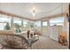 Peaceful sunroom featuring a comfy seating area at 3221 Pebble Bend Dr, Lakeland, FL 33810