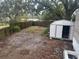 Large backyard with storage shed and wooden fence at 3472 Avenue V Nw, Winter Haven, FL 33881