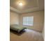 Well-lit bedroom with carpeted floor and double window at 357 Siesta Vista Ct, Davenport, FL 33896