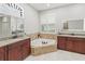 Elegant bathroom boasting a corner tub and dual vanities at 3604 Frentress Dr, Lakeland, FL 33812