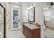 Bathroom with granite vanity and shower access to lanai at 3604 Frentress Dr, Lakeland, FL 33812