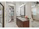 Bathroom with granite vanity and shower access to lanai at 3604 Frentress Dr, Lakeland, FL 33812