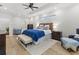 Bright bedroom featuring a king-size bed and hardwood floors at 3604 Frentress Dr, Lakeland, FL 33812