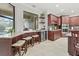 Kitchen features wine cooler, granite counters & breakfast bar at 3604 Frentress Dr, Lakeland, FL 33812