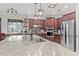 Gourmet kitchen boasts granite countertops and stainless steel appliances at 3604 Frentress Dr, Lakeland, FL 33812