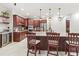 Modern kitchen with cherry wood cabinets and granite countertops at 3604 Frentress Dr, Lakeland, FL 33812