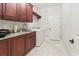 Laundry room with washer, dryer, and plenty of cabinets at 3604 Frentress Dr, Lakeland, FL 33812