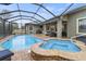 Enclosed pool and spa with patio furniture and screened enclosure at 3604 Frentress Dr, Lakeland, FL 33812