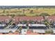 Aerial view of townhouses featuring covered parking and a golf course backdrop at 362 Enclave Dr, Lakeland, FL 33803