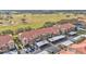 Aerial view of townhouses with golf course views and covered parking at 362 Enclave Dr, Lakeland, FL 33803