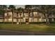 Condo building showcasing screened balconies and a well-maintained lawn at 362 Enclave Dr, Lakeland, FL 33803