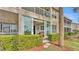 View of condo exterior with lush landscaping at 362 Enclave Dr, Lakeland, FL 33803