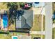 Aerial view of a house featuring a dark gray roof and a pool in the backyard at 408 Patrick Ave, Winter Haven, FL 33880