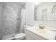 Updated bathroom with marble shower and vanity at 408 Patrick Ave, Winter Haven, FL 33880