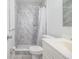 Bathroom with marble shower and white vanity at 408 Patrick Ave, Winter Haven, FL 33880