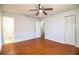 Bright bedroom with wood floors, and access to bathroom and closet at 408 Patrick Ave, Winter Haven, FL 33880