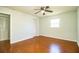 Bedroom with wood floors, ceiling fan and closet at 408 Patrick Ave, Winter Haven, FL 33880