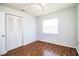 Bright bedroom with wood floors and ceiling fan at 408 Patrick Ave, Winter Haven, FL 33880