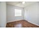 Simple bedroom with wood floors and ceiling fan at 408 Patrick Ave, Winter Haven, FL 33880