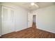 Well-lit bedroom with wood floors and closet at 408 Patrick Ave, Winter Haven, FL 33880