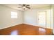 Bedroom with wood flooring, ceiling fan and exterior access at 408 Patrick Ave, Winter Haven, FL 33880