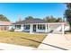 Newly renovated home featuring a covered porch and carport at 408 Patrick Ave, Winter Haven, FL 33880