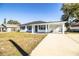 Newly renovated home with a covered porch and carport at 408 Patrick Ave, Winter Haven, FL 33880