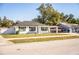 Charming single story home with a well-manicured lawn and a carport at 408 Patrick Ave, Winter Haven, FL 33880