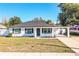 Newly renovated home with modern exterior and landscaped lawn at 408 Patrick Ave, Winter Haven, FL 33880